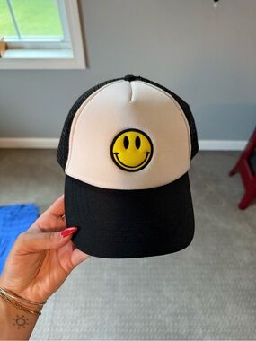 Black and White Trucker Hat with Yellow Smiley Patch